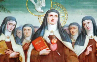 Santa Teresa de Jesus segurando seu livro "Caminho da Perfeição"