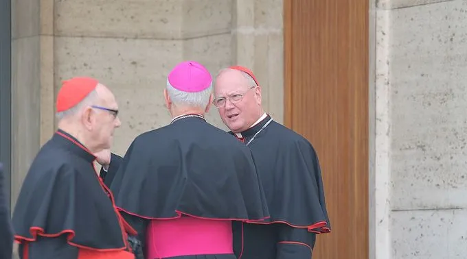 Cardinal_Timothy_Dolan_R_speaks_with_Archbishop_Jospeh_Kurtz_C_outside_the_Vaticans_Synod_Hall_on_Oct_13_2014_Credit_Bohumil_Petrik_CNA_CNA_10_13_14.jpg