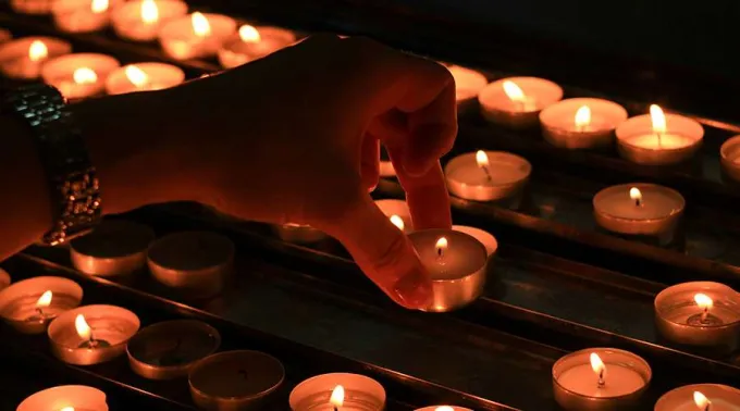 PersonWithCandle-071019.jpg ?? 