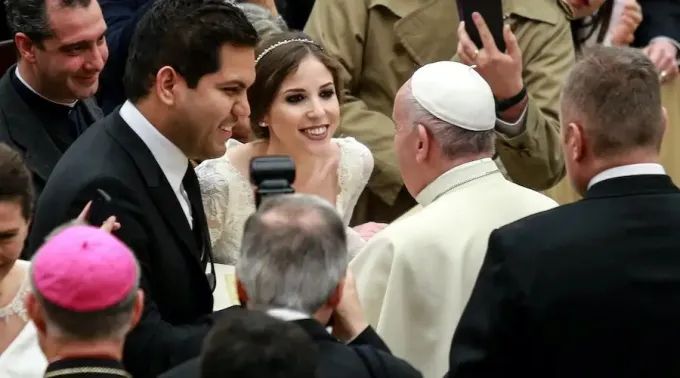 Pope_Francis_greets_newly_married_couple_at_the_ge.jpg