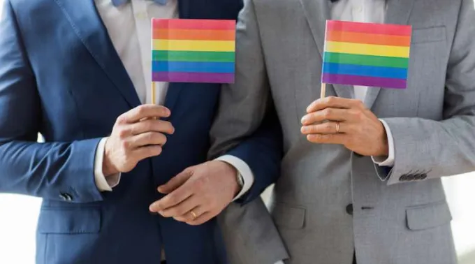grooms_with_rainbow_flags.jpg ?? 